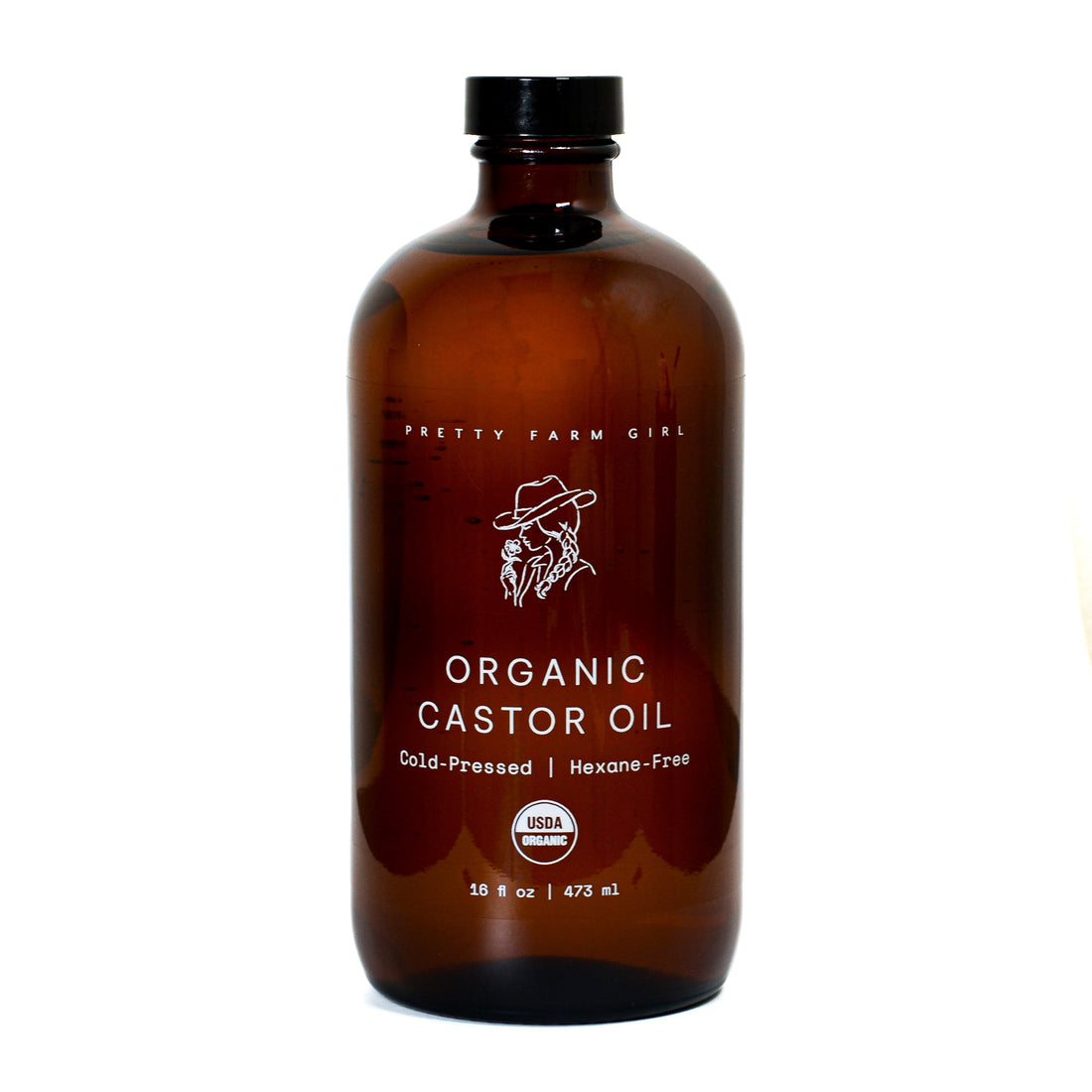Pure organic castor oil by Pretty Farm Girl, cold pressed and hexane-free, in a clear glass bottle with a dropper.