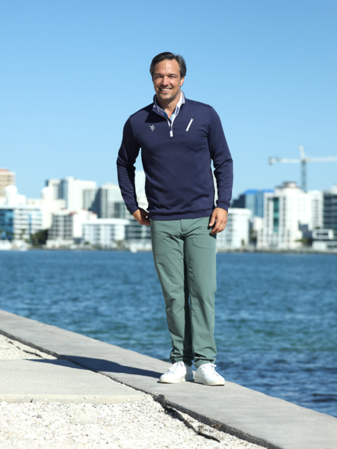 Navy blue Oceanside Pullover by White Water Life featuring smooth stretch fabric, displayed on a plain background.