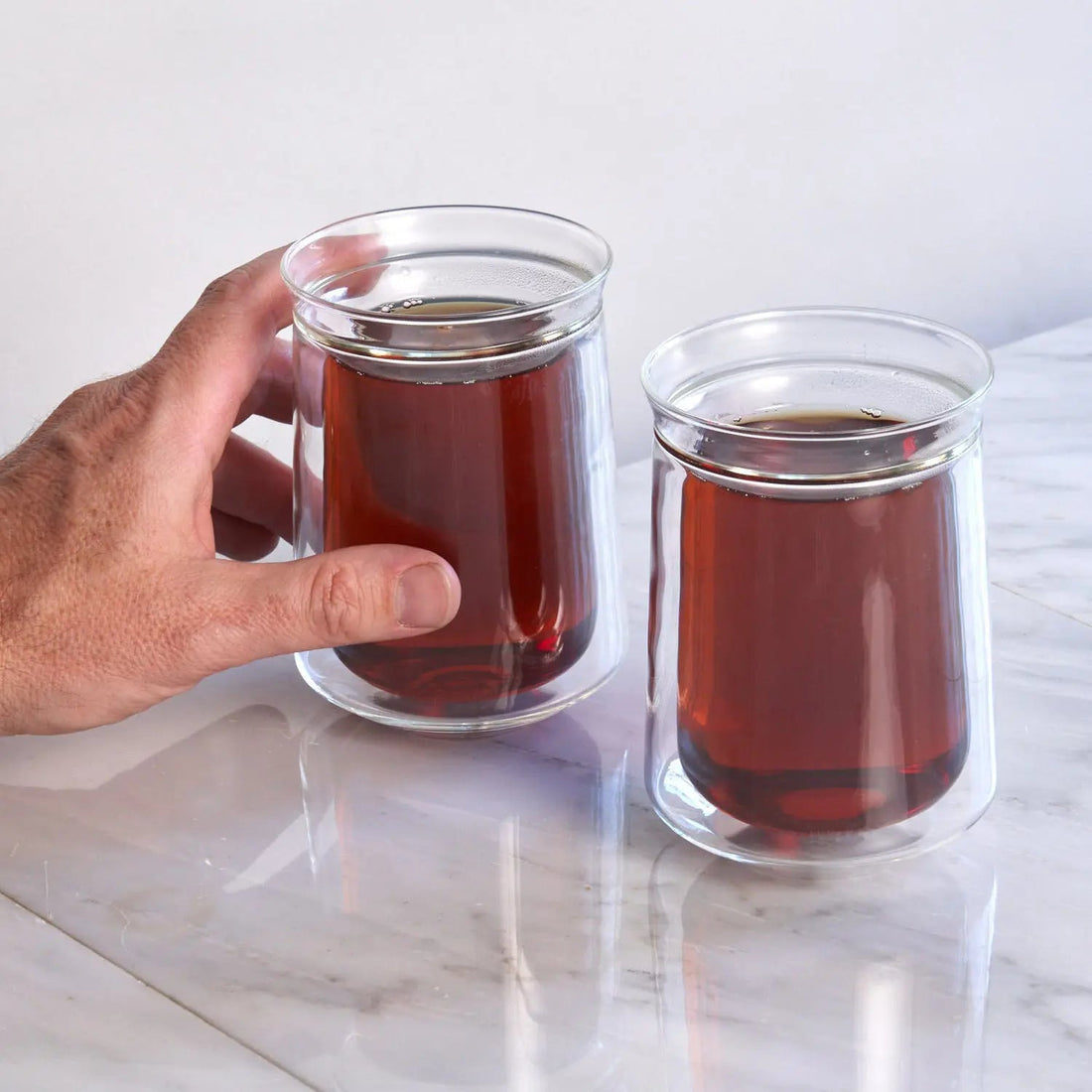 Oval tea set for two by August Uncommon Tea, includes tasting glasses for a perfect tea experience.
