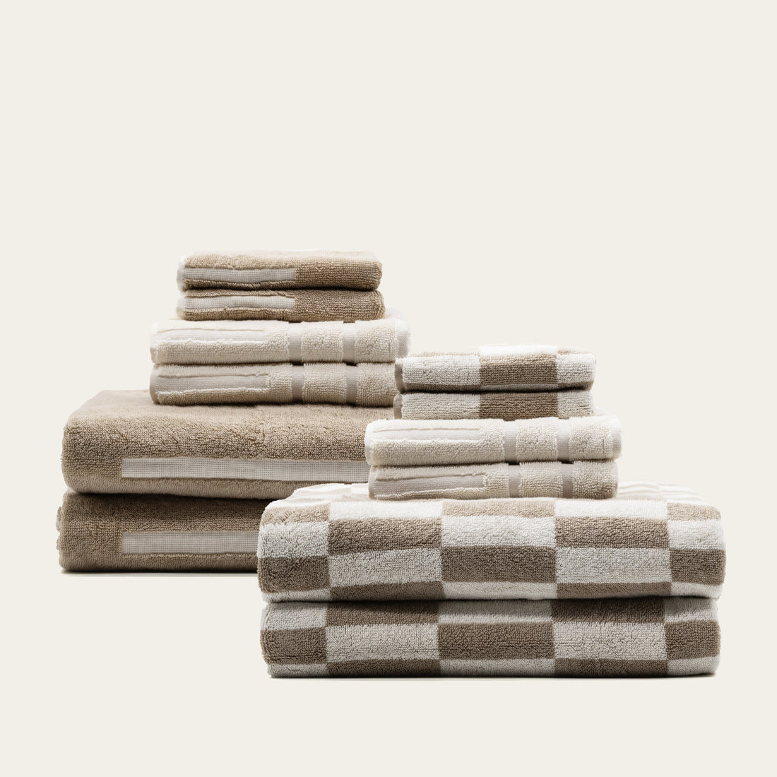 Set of Pietra Australian Cotton Towels by Italic, showcasing soft, plush white towels with textured weave pattern.