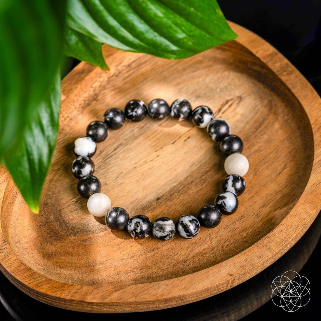 Zebra Jasper bracelet from Conscious Items featuring alternating black and white stone beads, stylish and natural accessory.