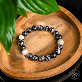 Zebra Jasper bracelet from Conscious Items featuring alternating black and white stone beads, stylish and natural accessory.