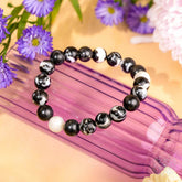 Zebra Jasper bracelet by Conscious Items featuring black and white patterned beads, designed for stylish natural stone jewelry.