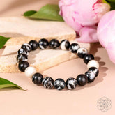 Zebra Jasper bracelet titled Permission to Pause from Conscious Items, featuring polished stone beads in black and white zebra pattern.