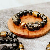 Conscious Items Pi Yao Wealth Bracelet featuring a traditional Chinese charm on a beaded bracelet for prosperity.