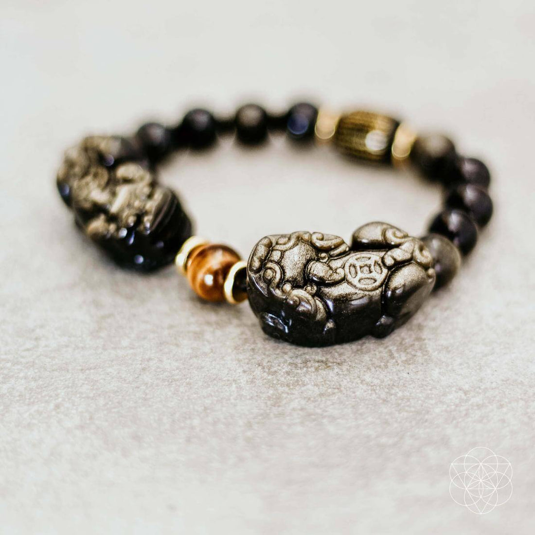 Conscious Items Pi Yao Wealth Bracelet featuring a gold-toned Pi Yao charm on a beaded bracelet for good luck and prosperity.