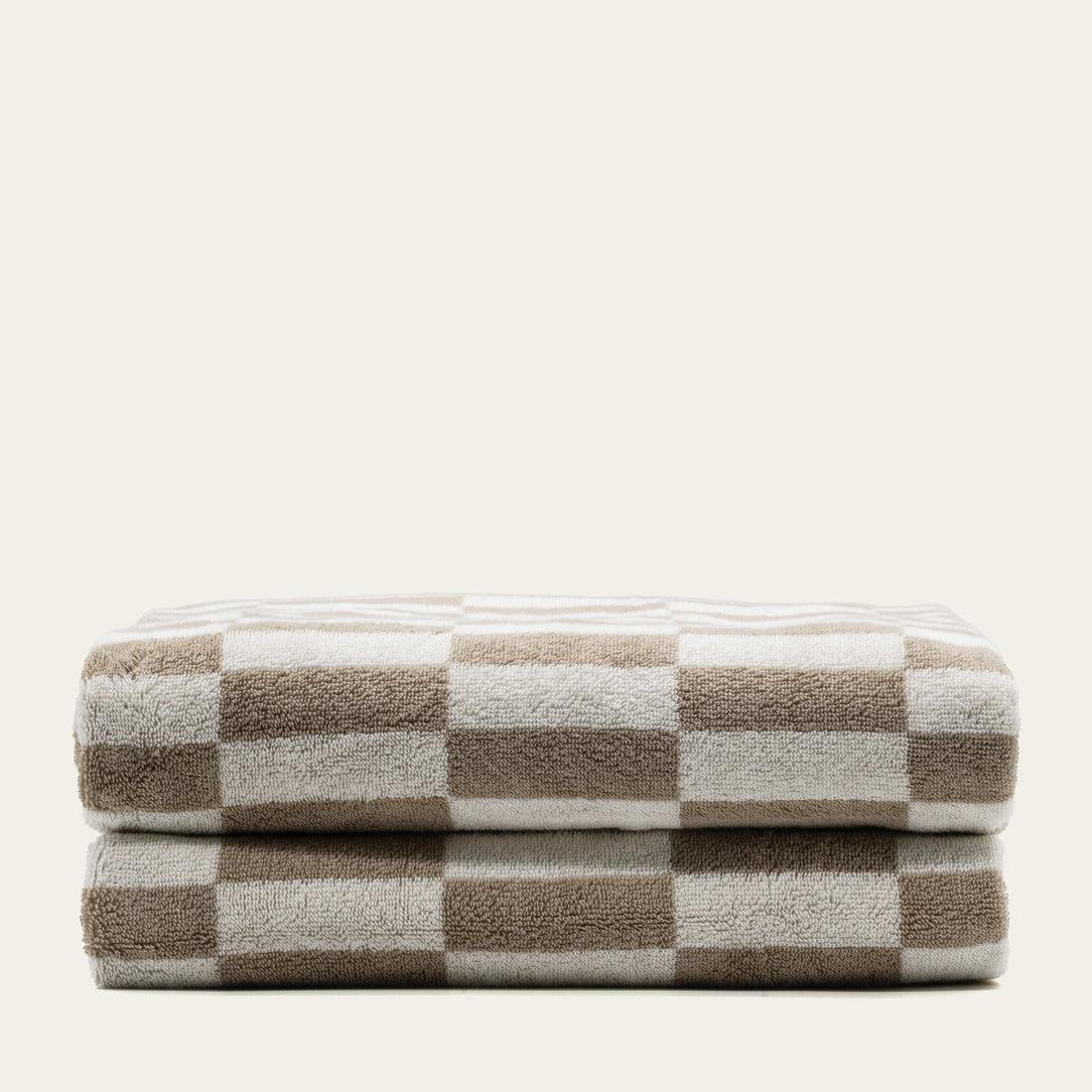 Italian Pietra Australian Cotton Bath Sheet by Italic, soft and plush white towel draped over a bathroom hook.