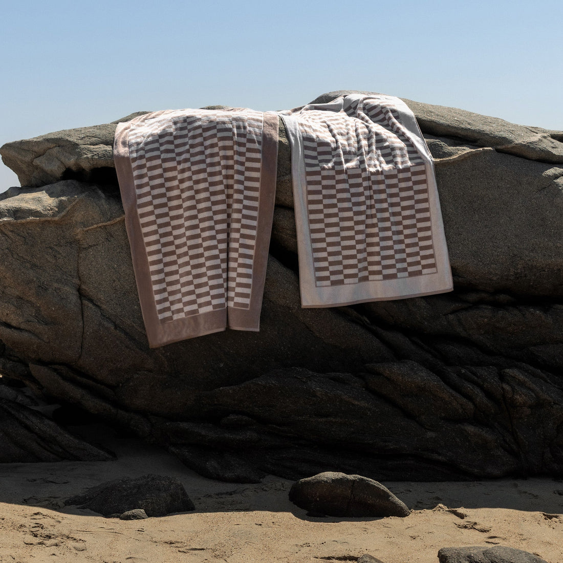 Large Pietra Australian Cotton Bath Towel by Italic, soft and plush with a textured white design, shown draped open.