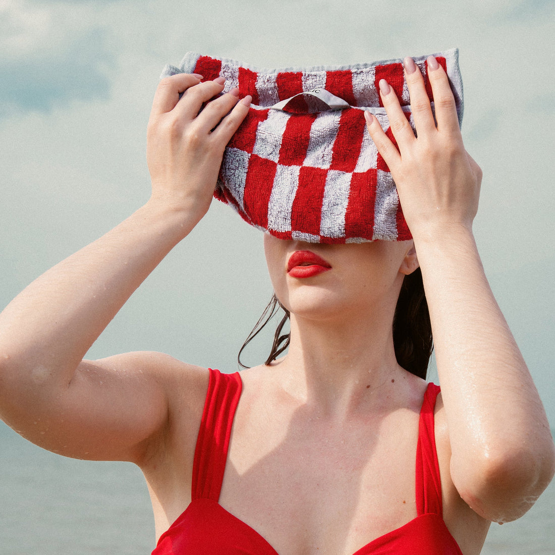 Red Pietra Australian cotton washcloth by Italic, soft plush texture, ideal for gentle skincare and bathroom use.