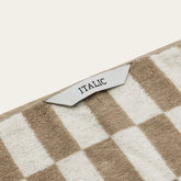 Pink Australian cotton washcloth with textured surface, part of Italic Pietra towel collection.