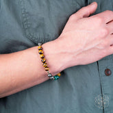 Conscious Items jewelry set featuring three stone bracelets, showcasing a variety of colorful gemstone beads on stretch cords.