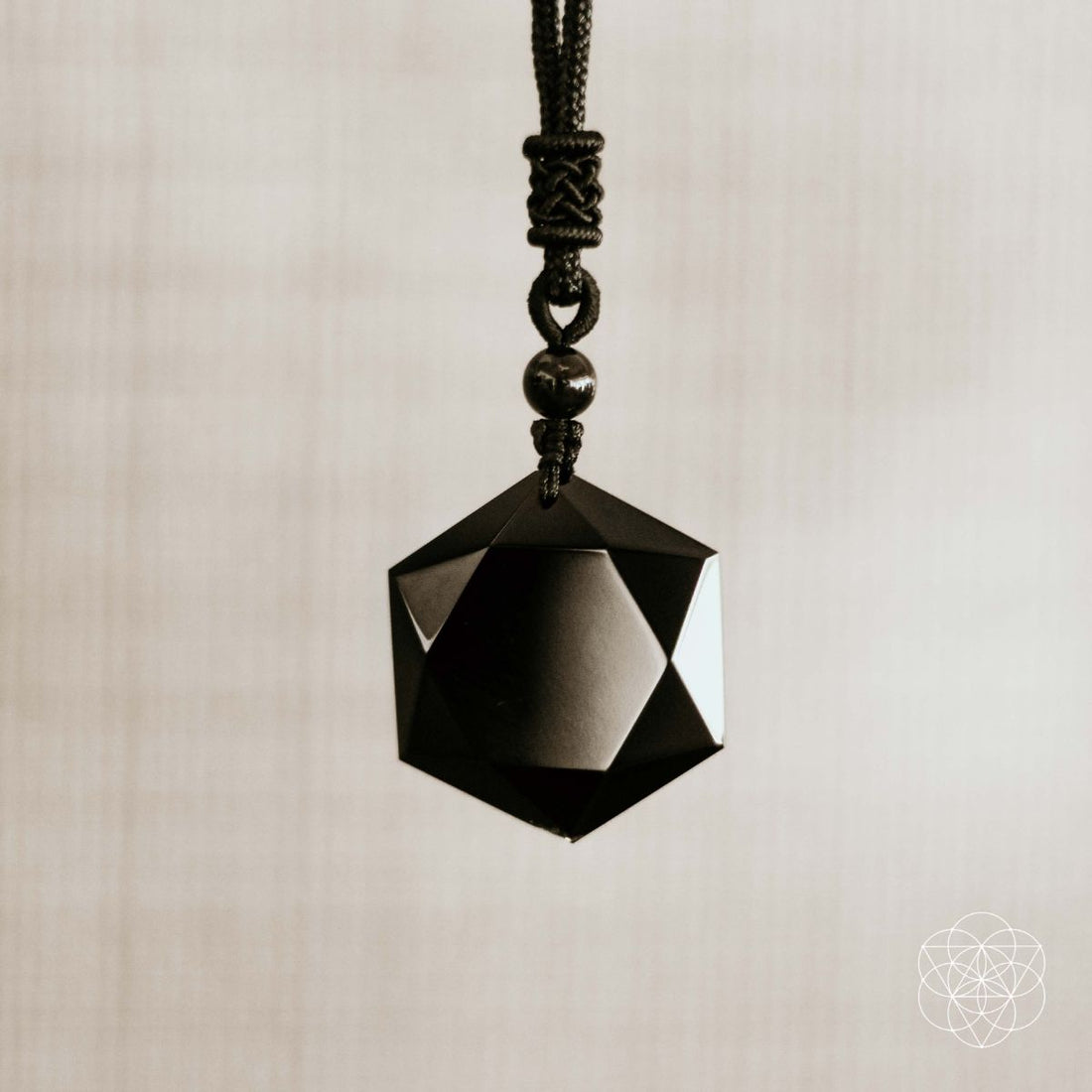 Black obsidian pendant necklace featuring a polished talisman from Conscious Items, showcasing a sleek, natural stone design.