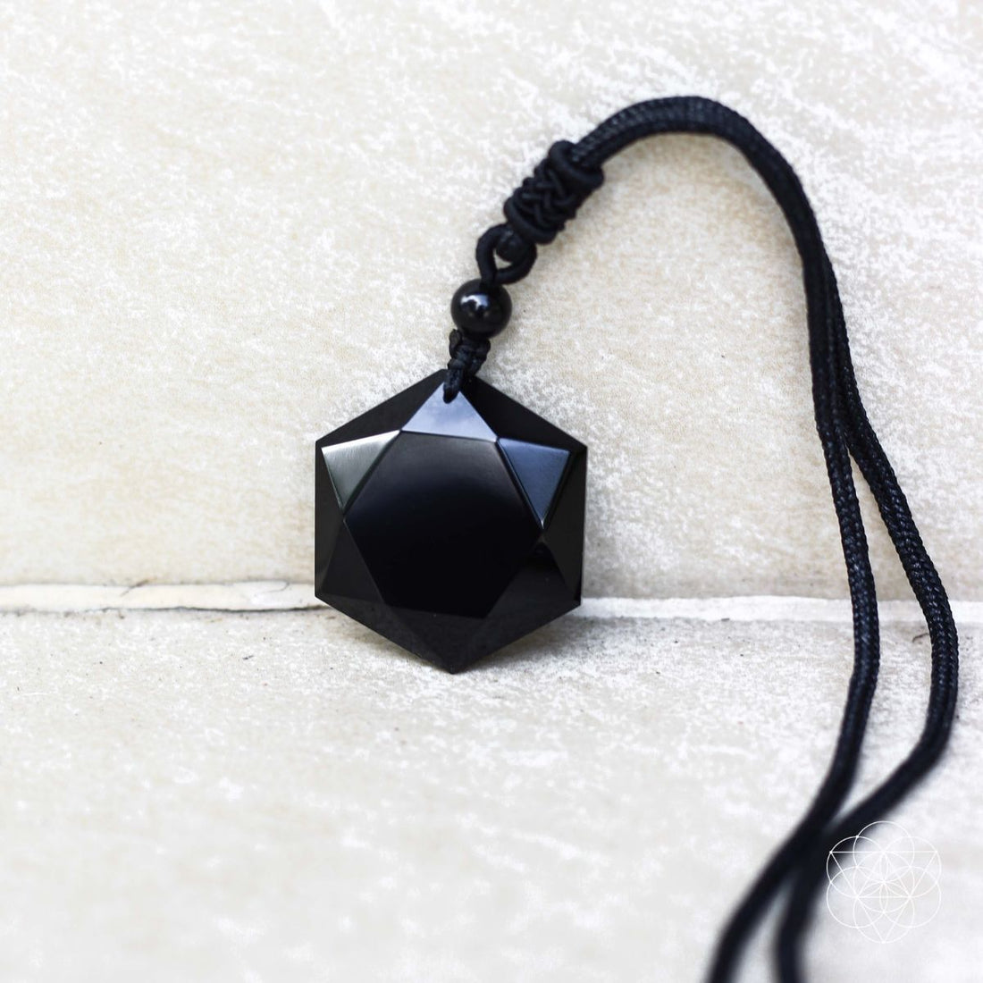 Black Obsidian Talisman pendant necklace from Conscious Items, featuring a polished black gemstone on a sleek cord.