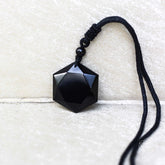 Black Obsidian Talisman pendant necklace from Conscious Items, featuring a polished black gemstone on a sleek cord.