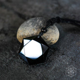 Black obsidian talisman pendant necklace from Conscious Items, featuring a polished black gemstone on a sleek cord.