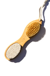Bamboo exfoliating foot pedicure tool from Pretty Farm Girl, showcasing the natural bamboo handle and textured exfoliation surface.