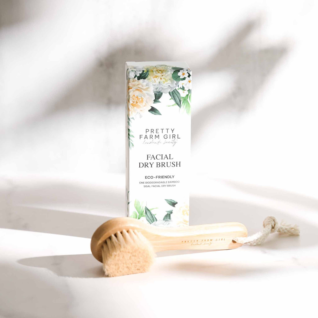 Pretty Farm Girl dry face brush, soft facial cleansing accessory with bristles for gentle skin exfoliation and refreshment.