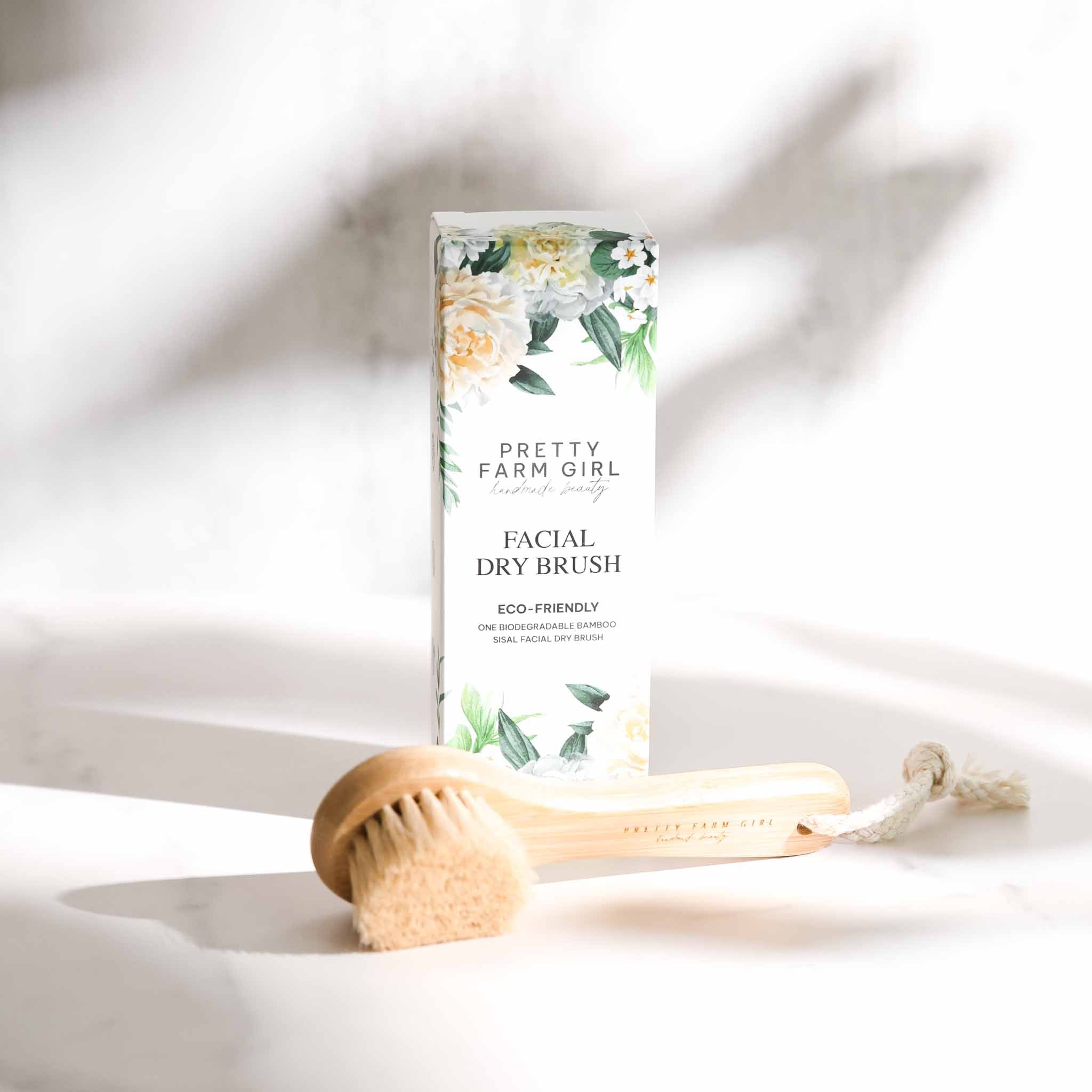 Pretty Farm Girl dry face brush, soft facial cleansing accessory with bristles for gentle skin exfoliation and refreshment.