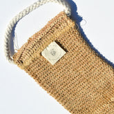 Sisal back exfoliating strap by Pretty Farm Girl, natural textured accessory for skin exfoliation and cleansing.