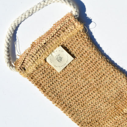 Sisal back exfoliating strap by Pretty Farm Girl, natural textured accessory for skin exfoliation and cleansing.