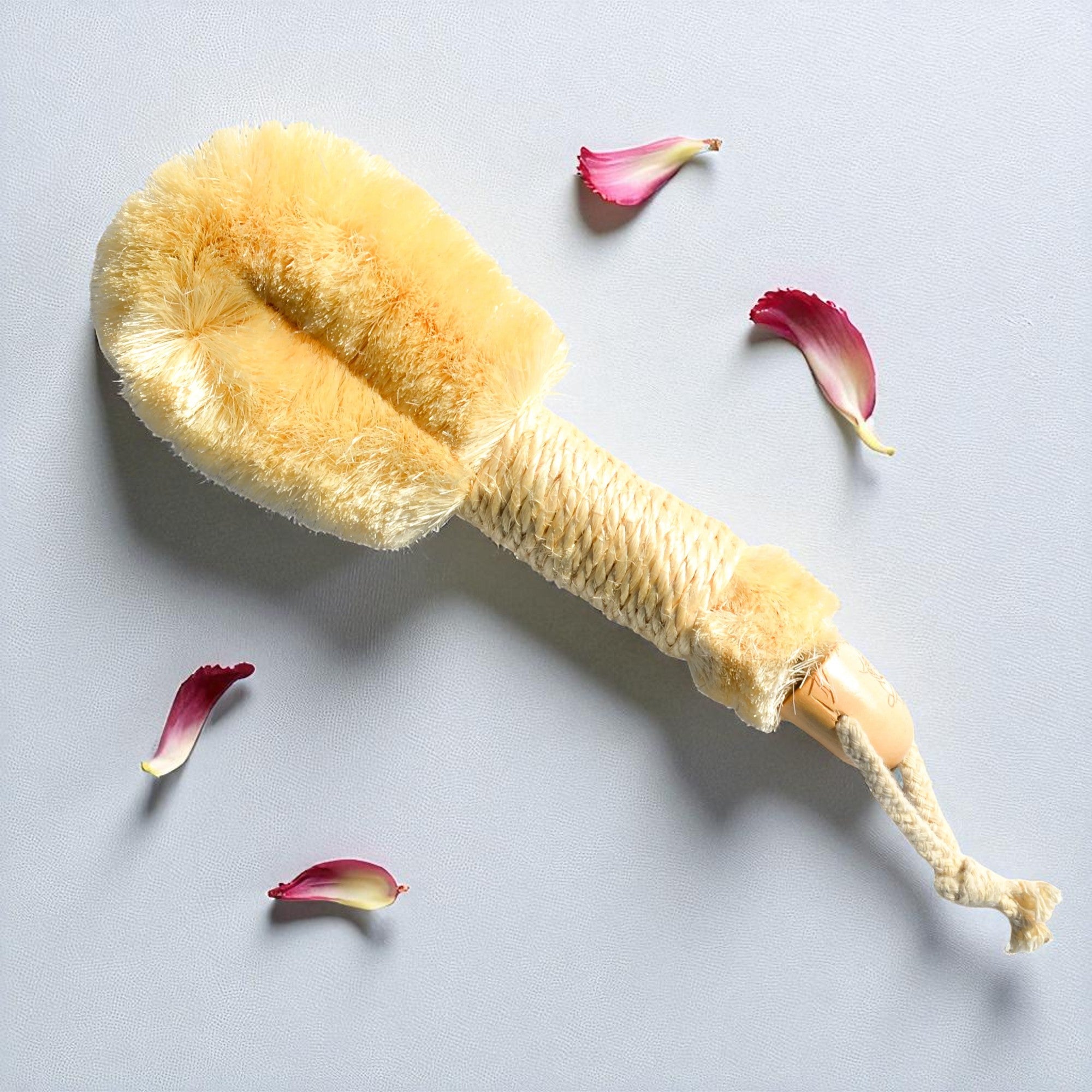 Pretty Farm Girl sisal exfoliating dry brush for skincare, featuring natural bristles and ergonomic handle for gentle exfoliation.