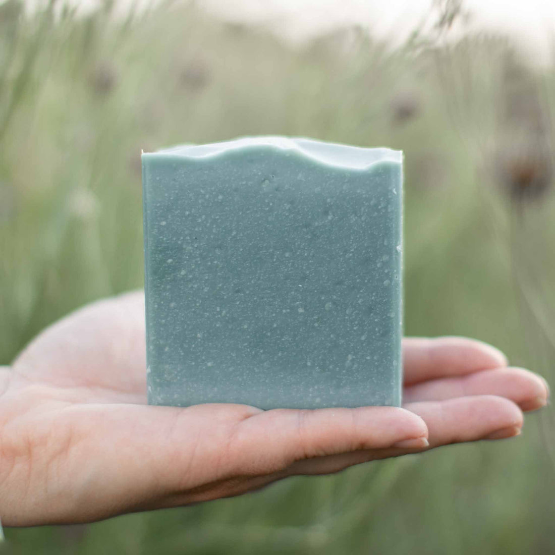 Blue Beauty Cream Facial Bar soap by Pretty Farm Girl, showing a square bar with a smooth blue surface and packaging.