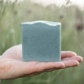 Blue Beauty Cream Facial Bar soap by Pretty Farm Girl, showing a square bar with a smooth blue surface and packaging.