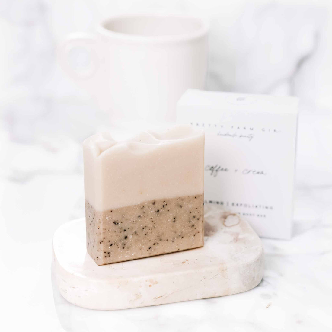 Handmade coffee and cream tallow and goat milk soap bar by Pretty Farm Girl, displayed in a box.
