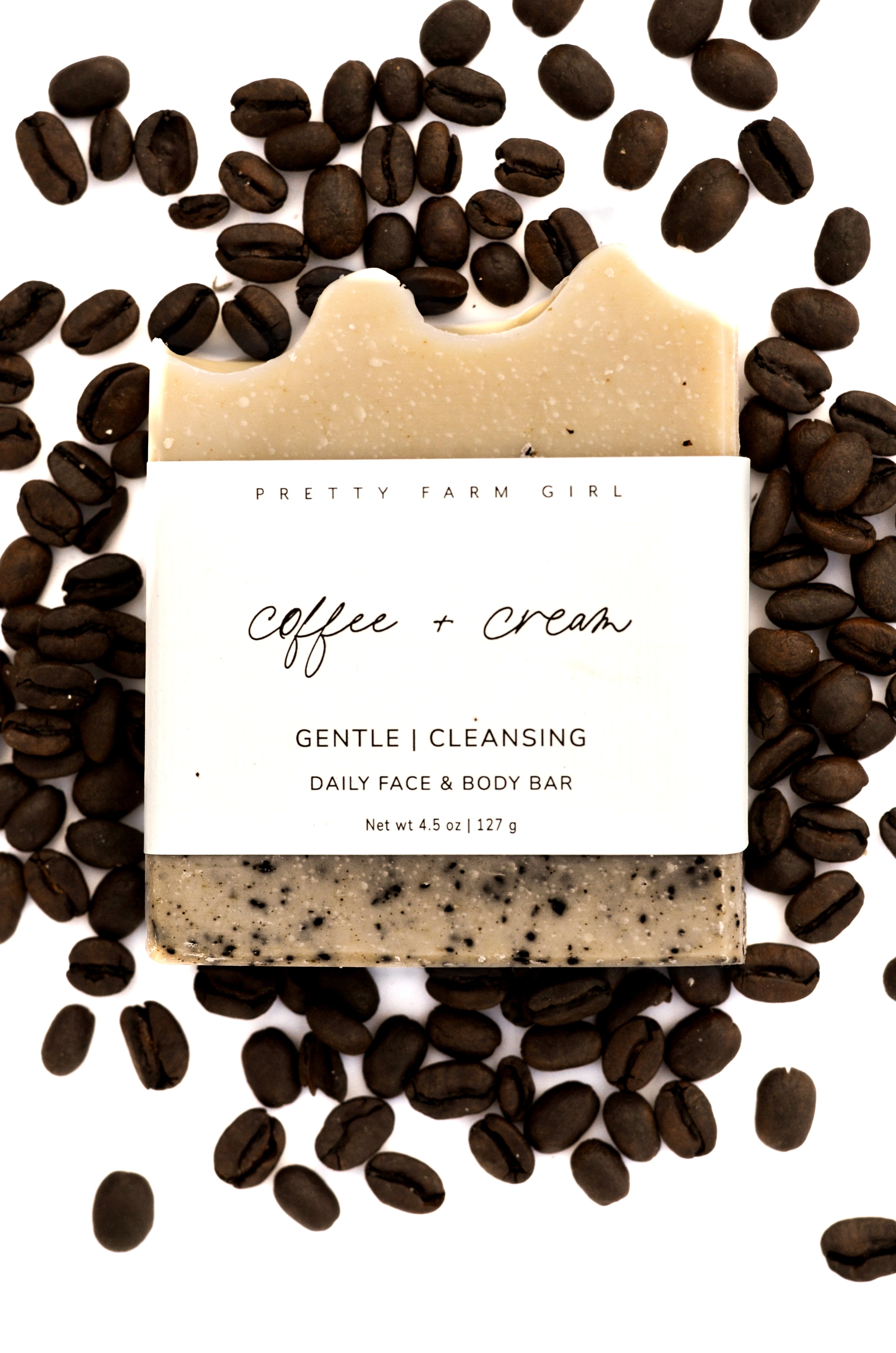 Handmade coffee and cream tallow and goat milk soap bar by Pretty Farm Girl, featuring a creamy, textured soap with coffee accents.