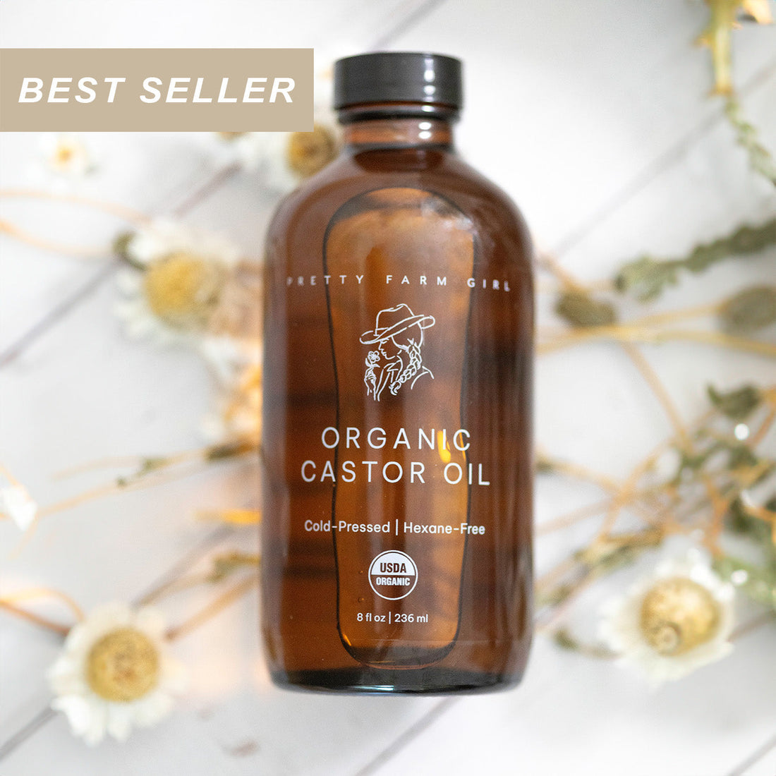 Pure organic castor oil by Pretty Farm Girl, 8oz bottle with label, featuring cold-pressed, hexane-free castor oil for skincare and hair.