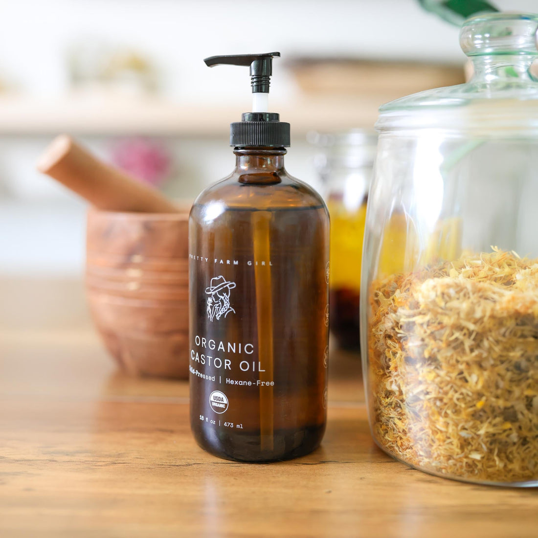 Pure organic castor oil in a 16oz pump bottle by Pretty Farm Girl, cold pressed and hexane-free for natural skin and hair care.