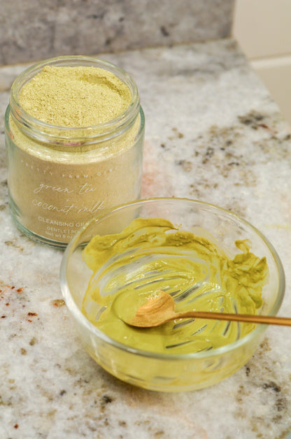 Pretty Farm Girl green tea and coconut milk facial cleansing grains in a jar, showing the natural textured product.