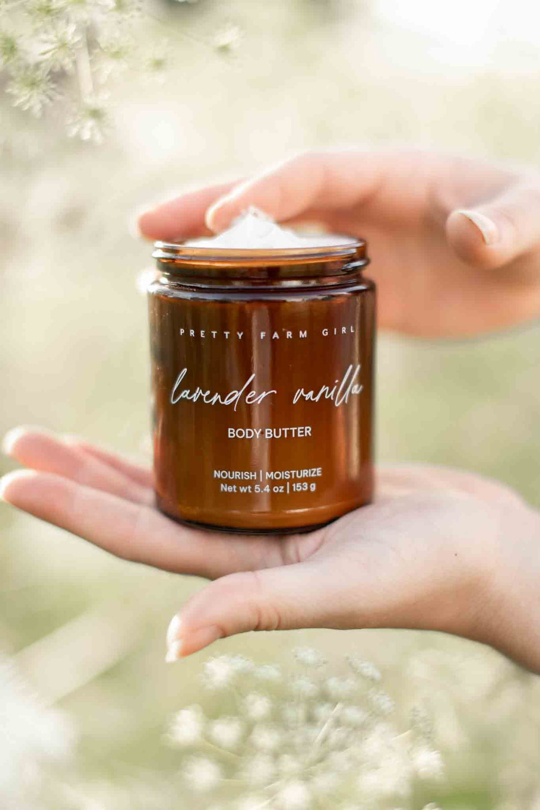 Lavender vanilla bean tallow body butter cream by Pretty Farm Girl, showing a smooth, creamy texture in a jar with lavender and vanilla scent.