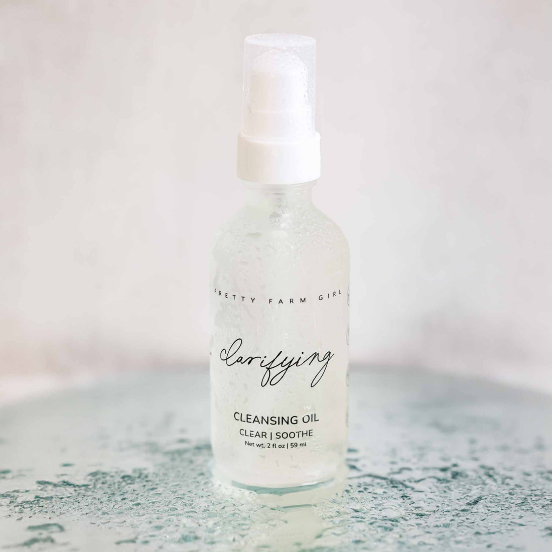 Pretty Farm Girl clarifying cleansing oil for acne-prone skin, featuring a bottle of face cleanser with natural ingredients.