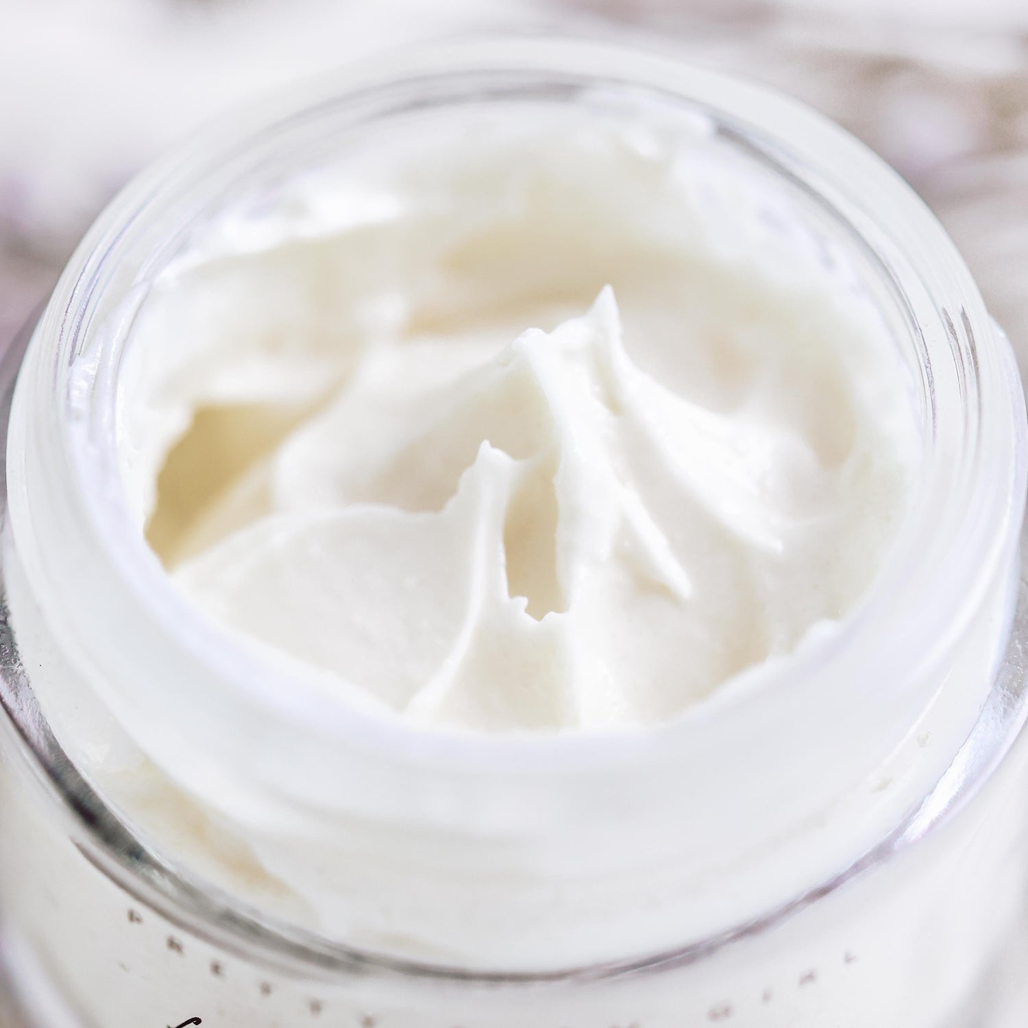 Cream jar of Pretty Farm Girl Fresh Face Cream Anti-Aging Tallow Moisturizer with a smooth, creamy texture visible in the image.