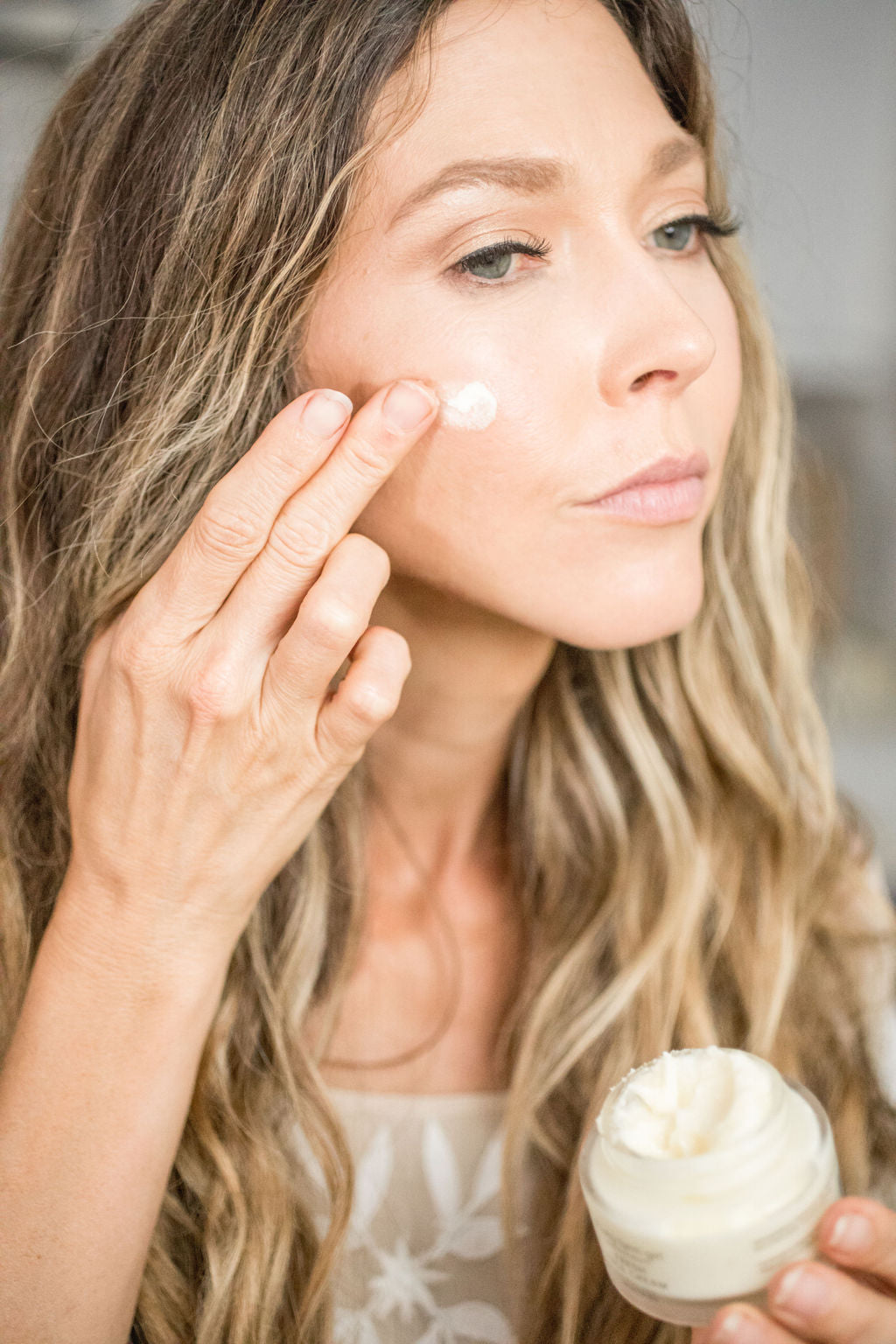 Pretty Farm Girl Fresh Face Cream, anti-aging tallow moisturizer, shown in a jar with smooth, hydrating cream inside.