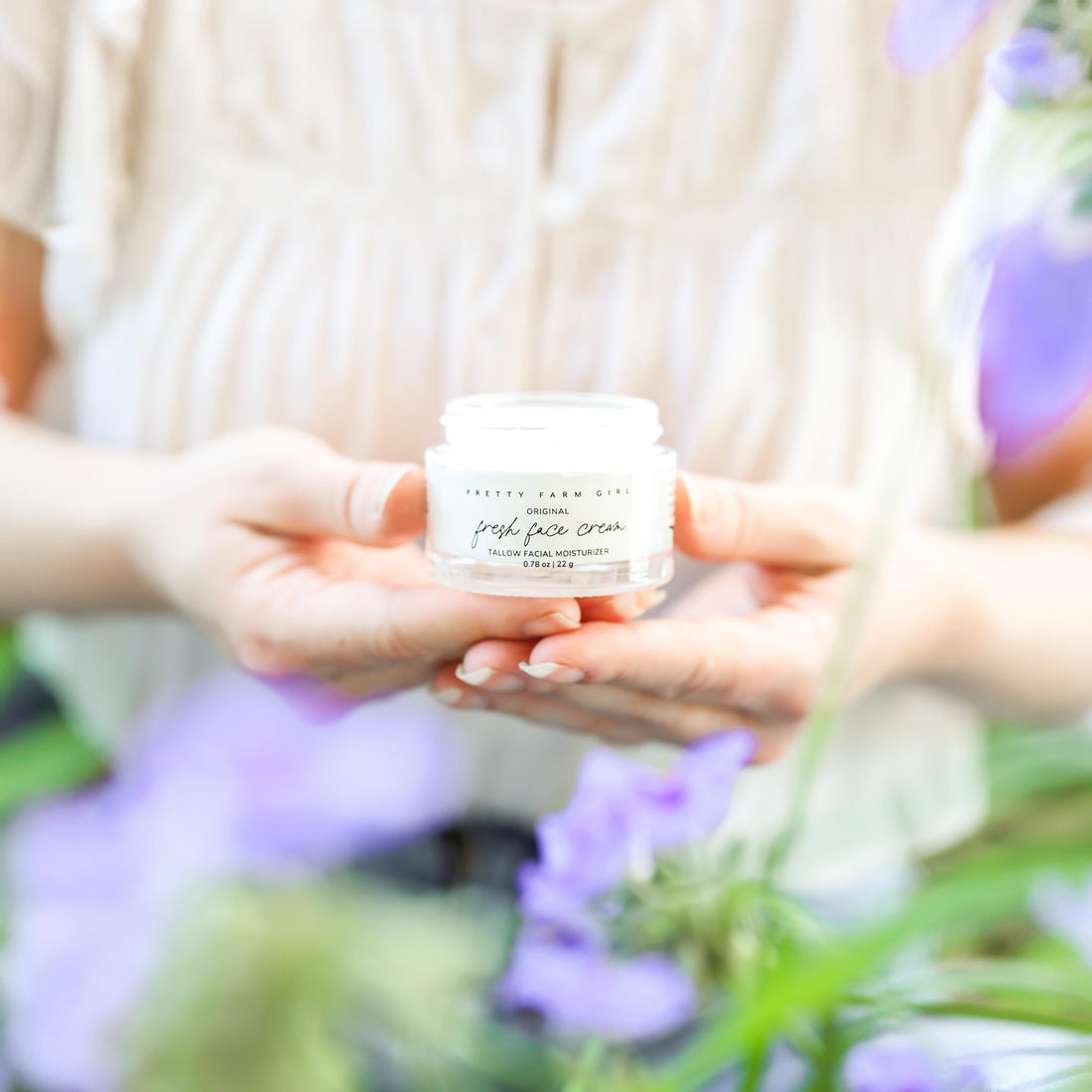 Fresh Face Cream by Pretty Farm Girl, anti-aging tallow moisturizer in a jar, with a smooth, creamy texture and natural ingredients.
