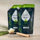 Puracy dish soap refill pack with two bottles, biodegradable and gentle for cleaning dishes and kitchenware.