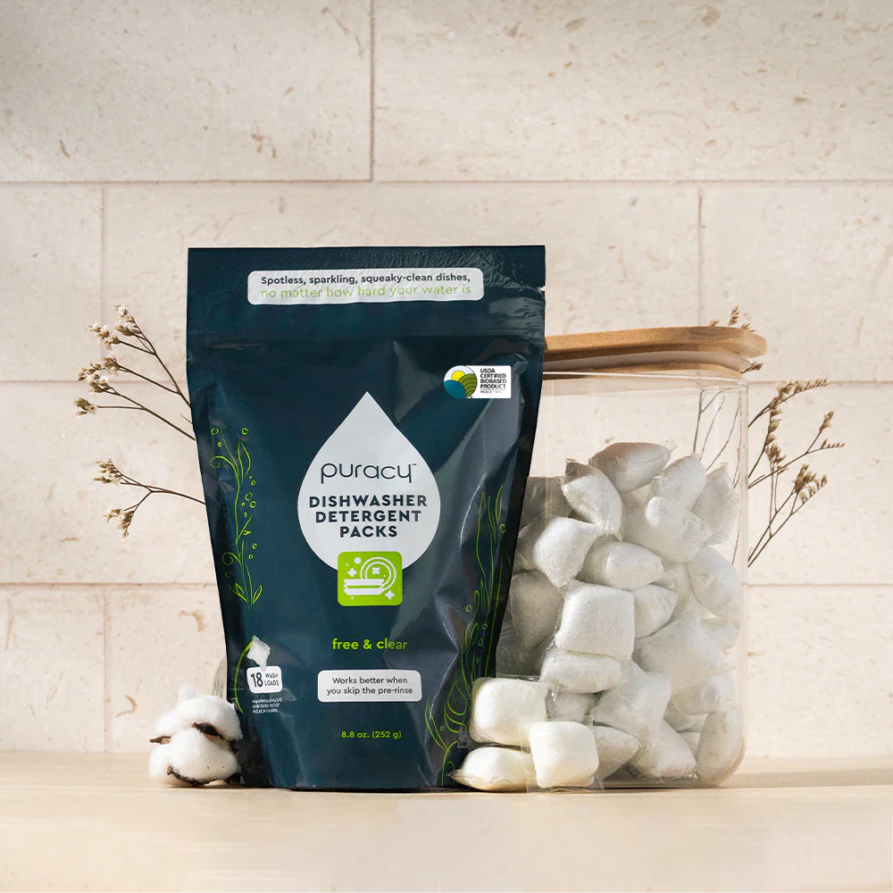 Puracy unscented dishwasher detergent pods in a clear container, designed for effective cleaning in dishwashers.