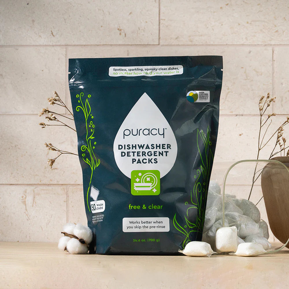 Puracy dishwasher detergent pods in a 50-count unscented pack, showing the small, white, pod-shaped cleaning tablets for dishwashers.