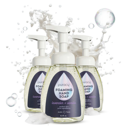 Puracy lavender vanilla foaming hand soap in a 3-pack of 8.5oz bottles with pump dispensers on a bathroom sink