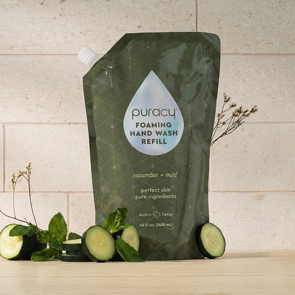 Three bottles of Puracy foaming hand soap in lavender vanilla scent, showcasing the packaging and pump dispensers.