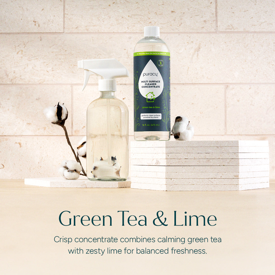 Puracy Everyday Multi-Surface Cleaner in green tea lime scent, showing a spray bottle with fresh citrus and herbal accents.