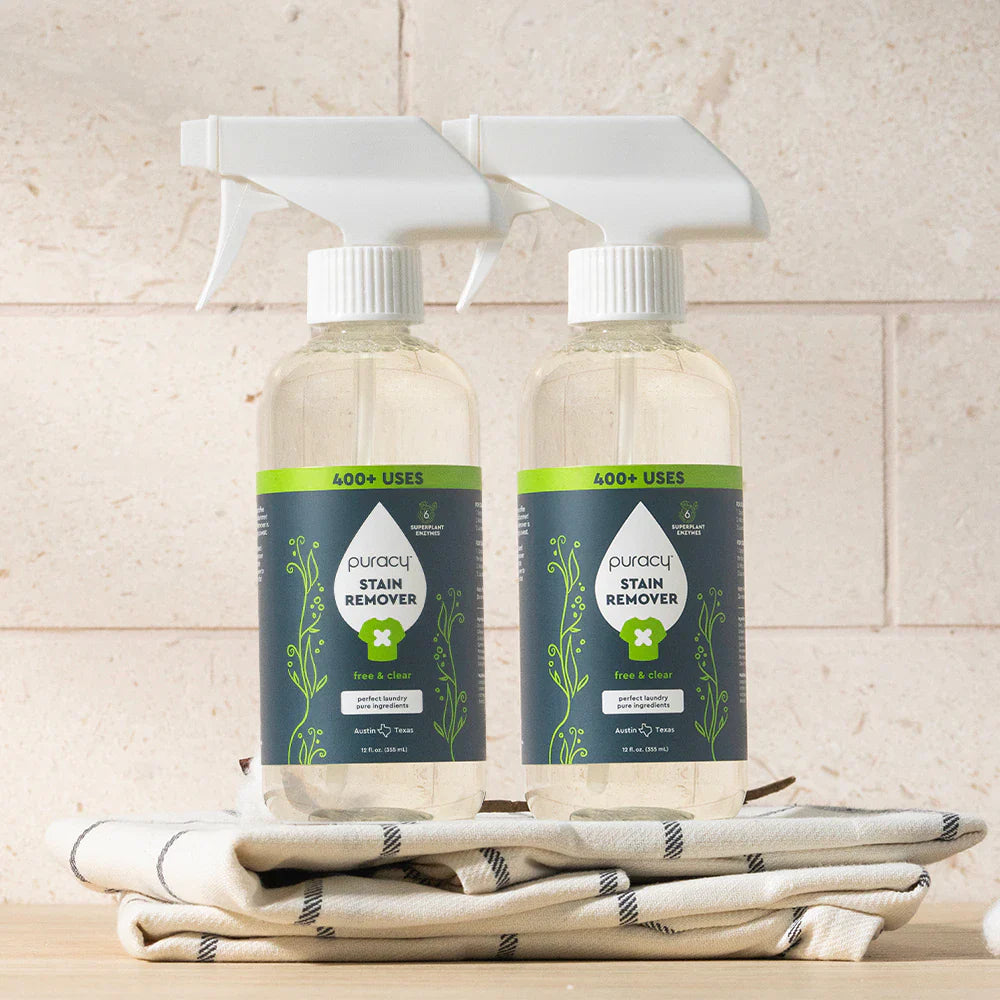Puracy laundry stain remover in a 12oz bottle, two-pack, for removing tough stains from clothes and fabrics.