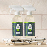Puracy laundry stain remover in a 12oz bottle, two-pack, for removing tough stains from clothes and fabrics.