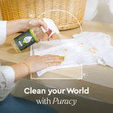 Puracy laundry stain remover bottle showing the 12oz size with a clean label and nozzle for treating stains on clothing.