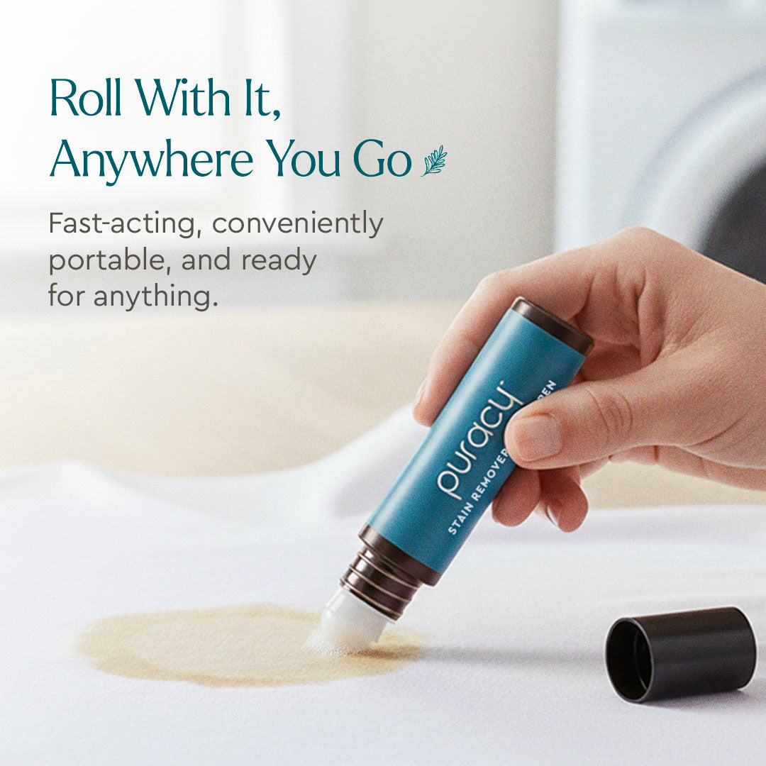 Puracy Laundry Stain Remover pen with a white and green design, displayed on a clean surface.