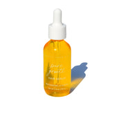 Pretty Farm Girl Pure Growth Hair Serum scalp and hair oil in a clear bottle with dropper for nourishing hair treatment.