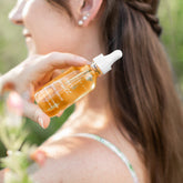 Pretty Farm Girl Pure Growth Hair Serum scalp and hair oil in a white bottle with a pump, ideal for nourishing hair and scalp.