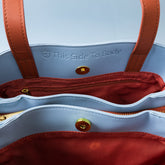Shield Your Body SYB purse for mobile phones, stylish accessory with multiple compartments for safe and organized phone storage.